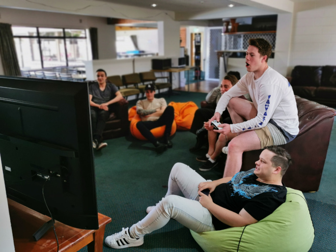 Students gaming in lounge