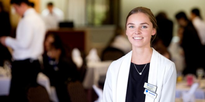 Student Duty Manager at PIHMS in white jacket